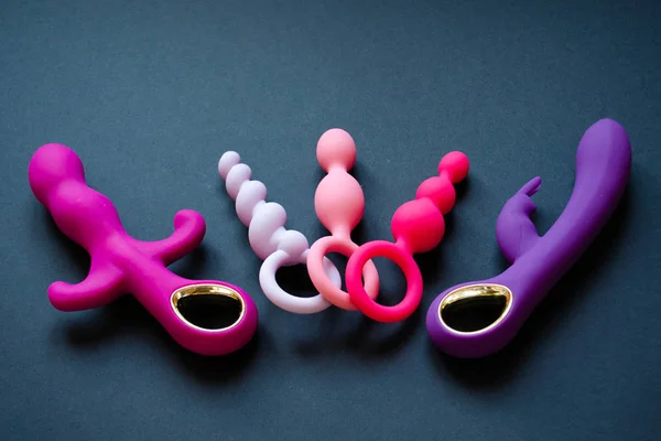 Sex toys. Vibrators and butt plugs on a black background. — 스톡 사진